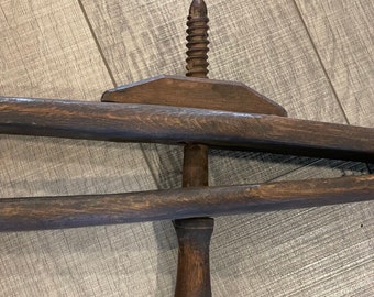 A neat and early barn find of an unusual antique primitive harness clamp with a wooden screw tightner from the 1800's.