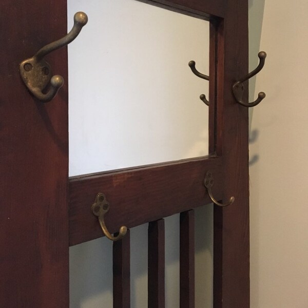 Now this is different! A mission oak hall stand for a narrow hall with hooks and a mirror.