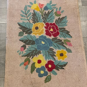 A nice floral hand hooked yarn rug in good condition from the 1960&#39;s from Prince Edward Island. #9