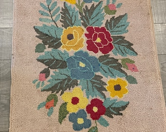 A nice floral hand hooked yarn rug in good condition from the 1960's from Prince Edward Island. #9