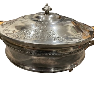 Footed Depression era silver plated serving dish with lid and glass insert with bakelite handles