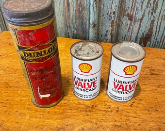 Grupo de latas de Shell y Dunlop.