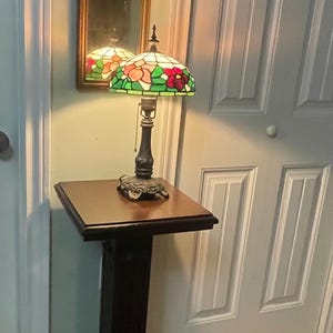 Pedestal style dark wood plant stand or hall table