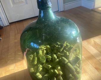 antique demi-john blown dark green bottle in good antique condition.