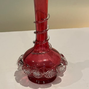 Antique cranberry glass vase with applied clear glass rings and crimping.