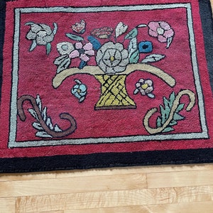 An early PEI hand rag hooked rug with nice colors in good condition.  #22