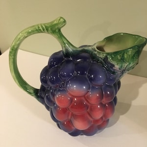 A great juice/water/milk jug from Italy with grape design.