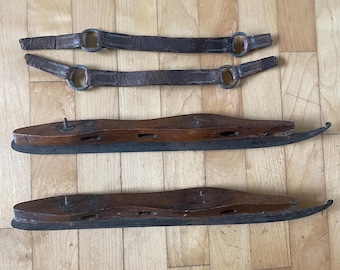 A great pair of early antique wood and metal ice skates in nice "as found" condition.