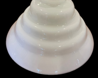 A 4 tier skyscraper milk glass lamp shade
