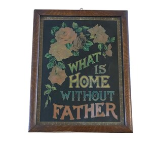 May include: A framed vintage print with the text "WHAT IS HOME WITHOUT FATHER" in colorful lettering. The print features a floral design with peach and brown roses against a dark background, encased in a wooden frame.