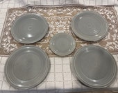 Set of four Vintage Homer Laughlin Fiestaware 9.5 quot plates and one 6.5 quot bread plate Grey (Circa 1936-1969)