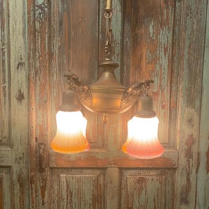 A gorgeous antique 1920's 4 arm pan light with original glass shades