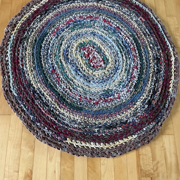 Colorful hand made braided rug in good condition. #26