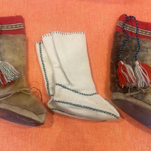 May include: A set of three ceramic nesting bowls in shades of blue, green, and white. The bowls have a speckled glaze and a simple, modern design. The largest bowl is about 15 cm in diameter.