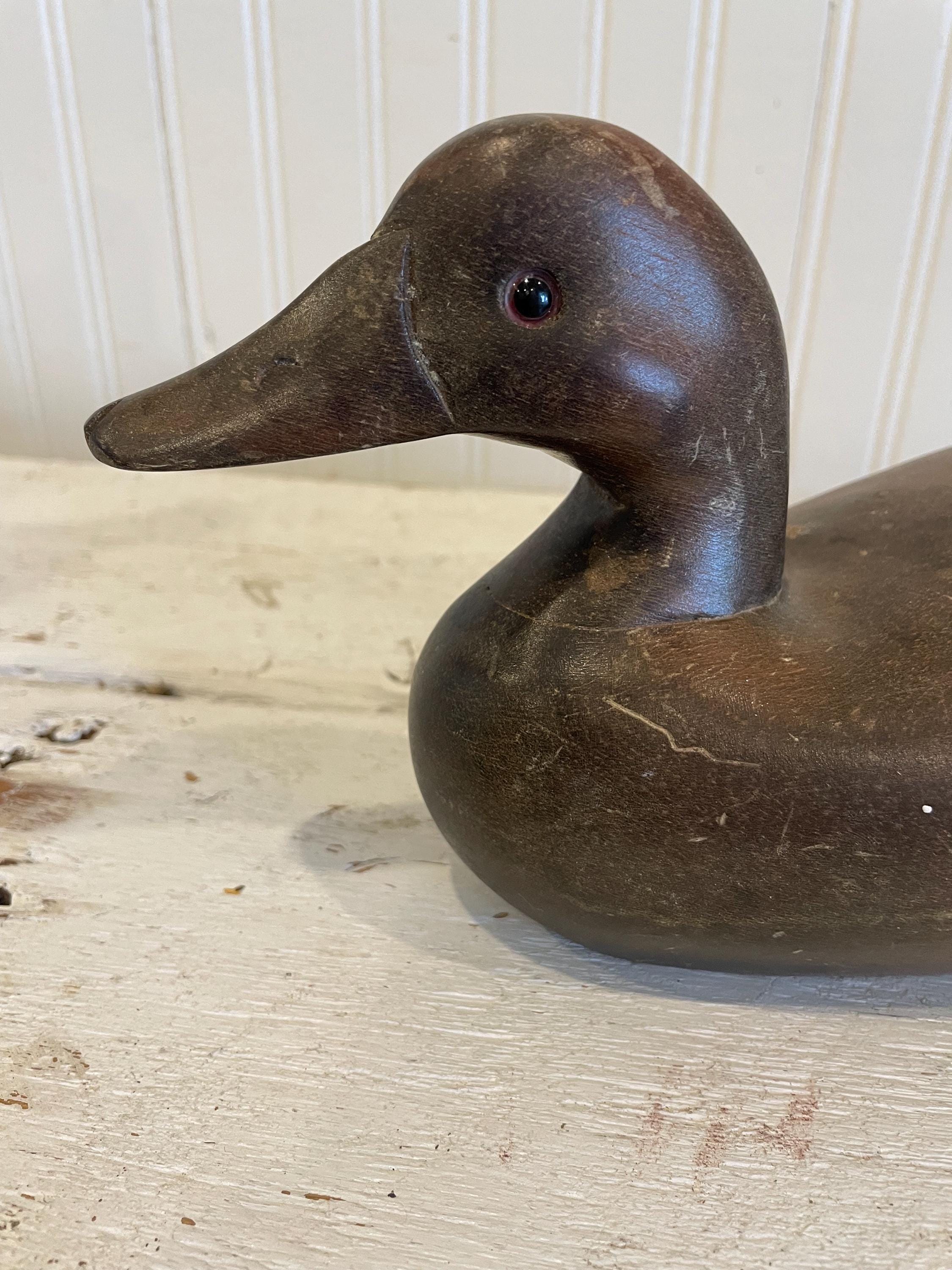 A nicely carved mid century mallard duck decoy with lots of scratches so in need of a new paint job!