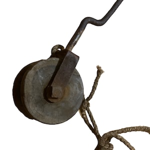 An antique lobster boat gunnel pulley from the mid 20th century.