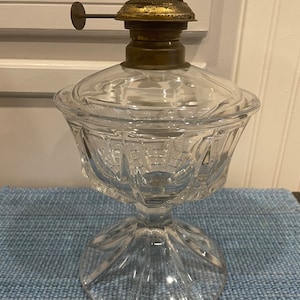 An antique rare flint glass kerosene /oil lamp from the 19th century with its original burner.