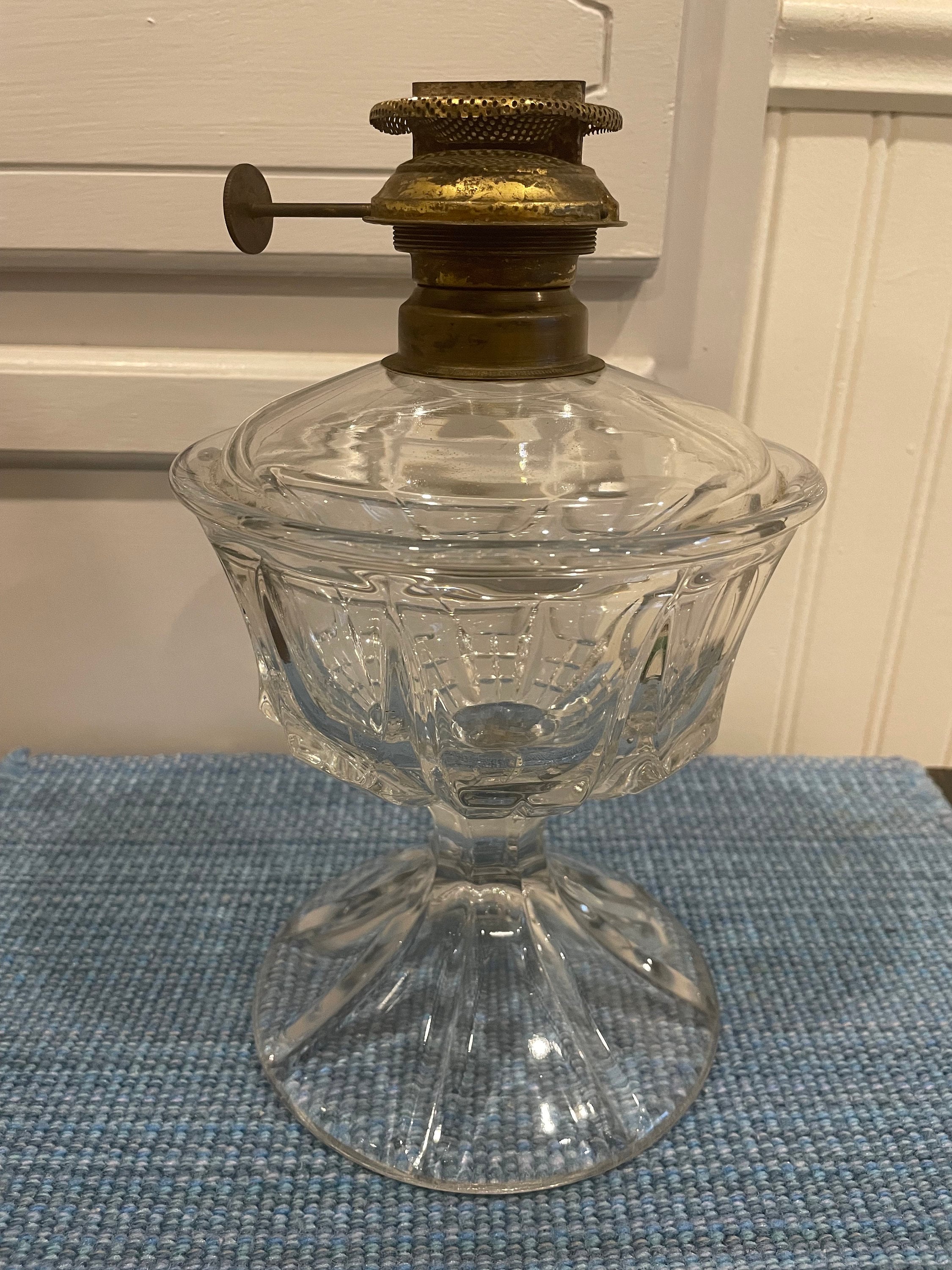 An antique rare flint glass kerosene /oil lamp from the 19th century with its original burner.