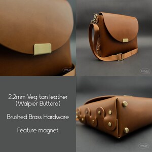 May include: A brown leather crossbody bag with a flap closure and a magnetic clasp. The bag has brushed brass hardware and a 2.2mm thick veg tan leather construction. The bag is made of Walpier Buttero leather.