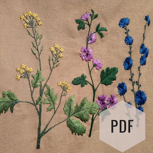 May include: Embroidered floral design on a beige fabric background. The design features yellow, green, blue, and purple flowers.
