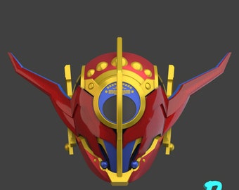 May include: A red and gold helmet with a blue visor and a gold crown. The helmet has a geometric design with sharp angles and curves.