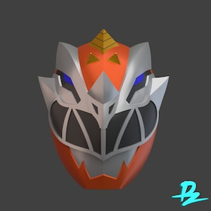May include: A 3D printed helmet in orange, silver and black with a pointed crest. The helmet has a stylised face with sharp teeth and blue eyes.