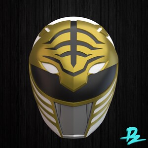 May include: A gold and white Power Ranger helmet with black accents. The helmet features a tiger-like design on the front and a black visor area. The helmet is set against a dark wood grain background.