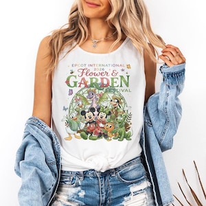 May include: A set of three ceramic mugs with a speckled, matte finish. The mugs are in shades of cream, light gray, and dark gray. Each mug has a simple, modern design and a rounded handle.