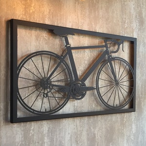 Artistic metal wall art of a classic bicycle, capturing the essence of cycling passion. This piece blends artistry with the spirit of adventure, making it a standout decor.