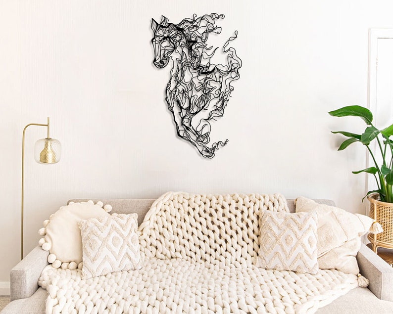 Elegant matte black metal wall art featuring an intricately designed horse, perfect for farmhouse or equestrian-themed decor.
