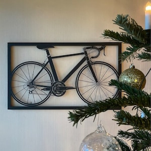 Elegantly crafted metal artwork featuring a detailed bicycle, evoking a sense of freedom and cycling joy. A timeless addition to any cyclist's home, offering a unique decorative touch.