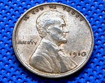 1910 Lincoln Wheat Penny in VF condition, clear cheekbone/jawbone separation, great hair detail and near full wheat lines
