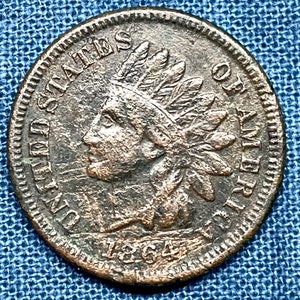 1864 Rotated Reverse Indian Head Error penny in G+ condition, possible “L”, Liberty visible with some ribbon/hair detail