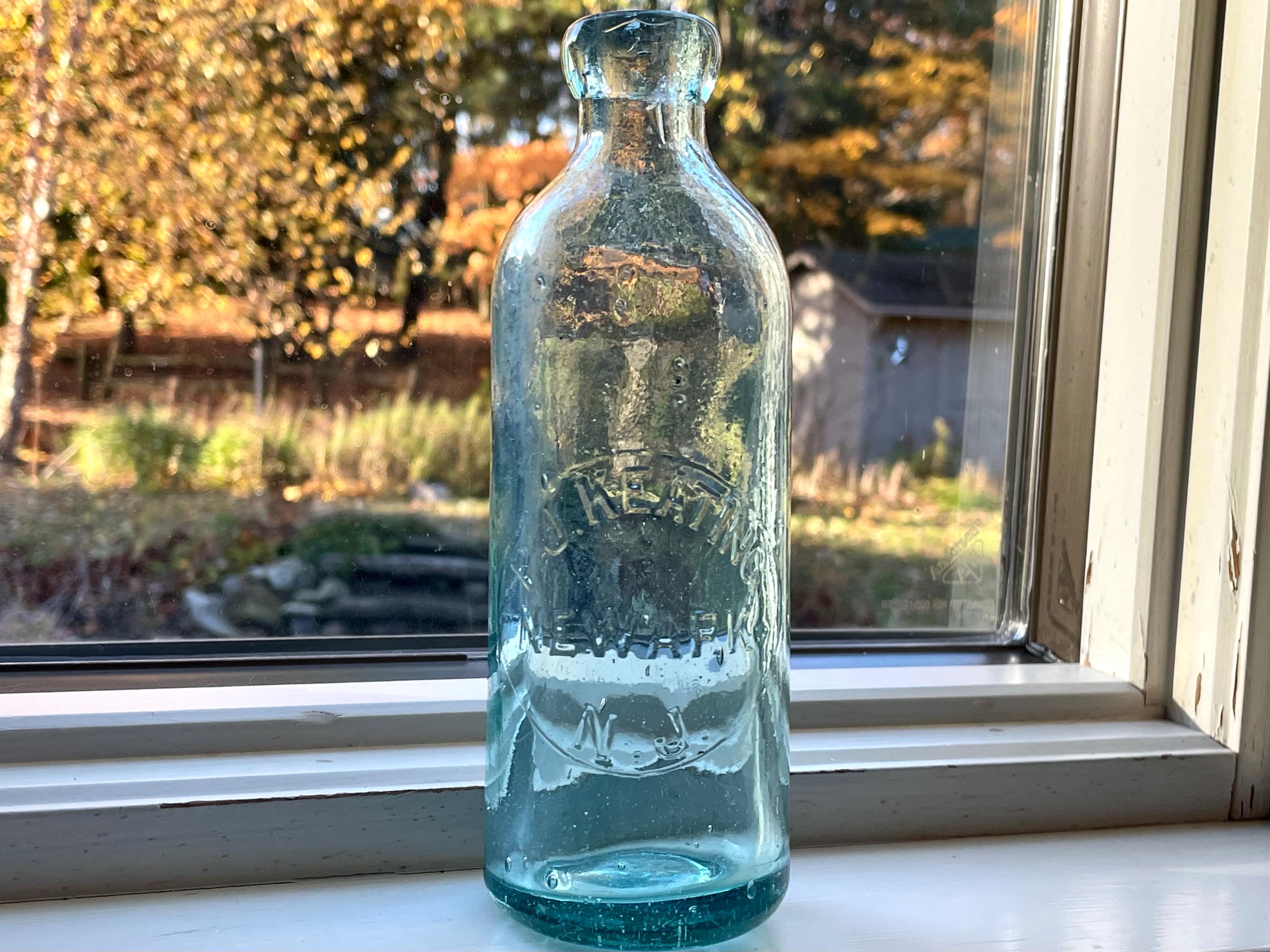1800s Embossed Rounded Bottom Hutchinson Bottle, P.J. Keating 