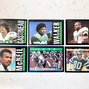 1985 (11 cards) Topps NY Jets team set in mint+ (grade 9+) to near-mint (grade 8) condition
