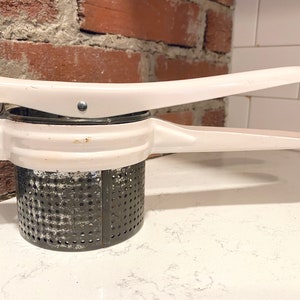 Mid 1900s Antique Ricer with White Metal Handle