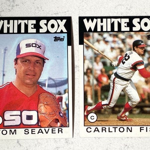 1986 Carlton Fisk & Tom Seaver Topps Baseball cards in mint (grade 9) to gem-mint (grade 10) condition