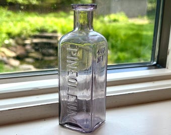 Early 1900’s Amethyst Manganese Pineoleum 4oz. cork top Medicine bottle, no chips or cracks, antique apothecary