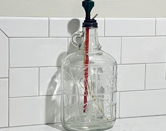 Mid 1900’s Embossed Half Gallon winemaker’s bottle in perfect condition, no chips or cracks