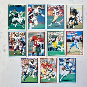 1985 Topps NFL Mini-Stickers lot (11), Warren Moon RC, Dan Marino, Joe Montana, Marcus Allen, Lawrence Taylor, Dwight Clark