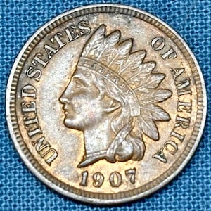 1907 Indian Head penny in AU condition, liberty and diamonds fully visible