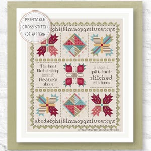May include: Printable cross stitch PDF pattern featuring a quilt design with colorful geometric shapes and the alphabet. The text reads "The best kind of sleep beneath Heaven above" and "is under a quilt, hand-stitched with love." The design is framed in a white mat.