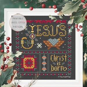 May include: Printable cross stitch pattern featuring a Christmas design with the text "Jesus is born" and a manger scene. The pattern is on a black background with red, yellow, and green accents.