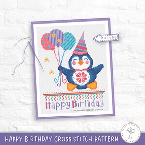 May include: Cross-stitch pattern featuring a blue penguin wearing a party hat and holding balloons. The design includes the text "Happy Birthday" and is framed in a purple border. The image also includes the text "Stitch Me".