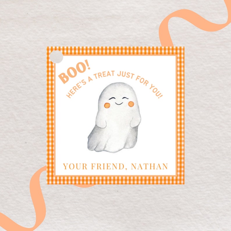 May include: A Halloween-themed gift tag with a watercolor illustration of a friendly ghost. The tag has an orange gingham border and reads "Boo! Here's a treat just for you!" with the name "Nathan" at the bottom.