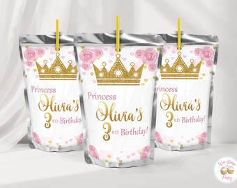 May include: Three silver foil drink pouches with yellow straws, featuring a gold glitter crown, pink watercolor roses, and small gold hearts. The text reads Princess Olivia's 3rd Birthday! in gold and pink script and block lettering on a white background.