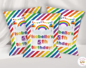 May include: Three rectangular party favor bags featuring a diagonal rainbow striped pattern. The center of each bag displays a white rectangular label with a colorful rainbow, clouds, balloons, bunting, and the text Isabella's 5th Birthday!