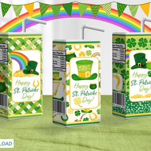 May include: Three juice boxes with St. Patrick's Day designs. Each box features a green leprechaun hat, a pot of gold, and the text "Happy St. Patrick's Day!". A rainbow and green and yellow bunting are in the background.