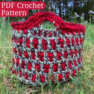 May include: A red and green crocheted basket with a handle. The basket is sitting on a bed of green grass. The text "PDF Crochet Pattern" is written in red letters at the top of the image.