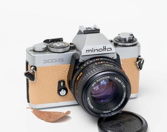 Vintage Minolta XD5 35 mm filmcamera met 50 mm lens